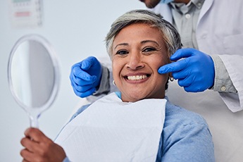 Patient in Manchester Center smiling after dental checkup 