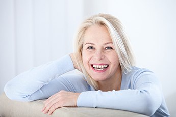 An older woman with dental implants