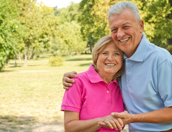 Couple holding hands smiling