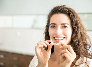 woman at dentist for Invisalign in Manchester