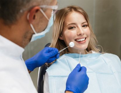 a patient smiling during a dental checkup