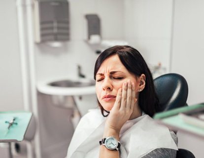 a patient experiencing tooth pain