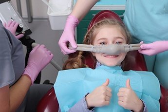 A girl receiving nitrous oxide sedation