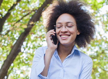 person speaking on the phone outsid